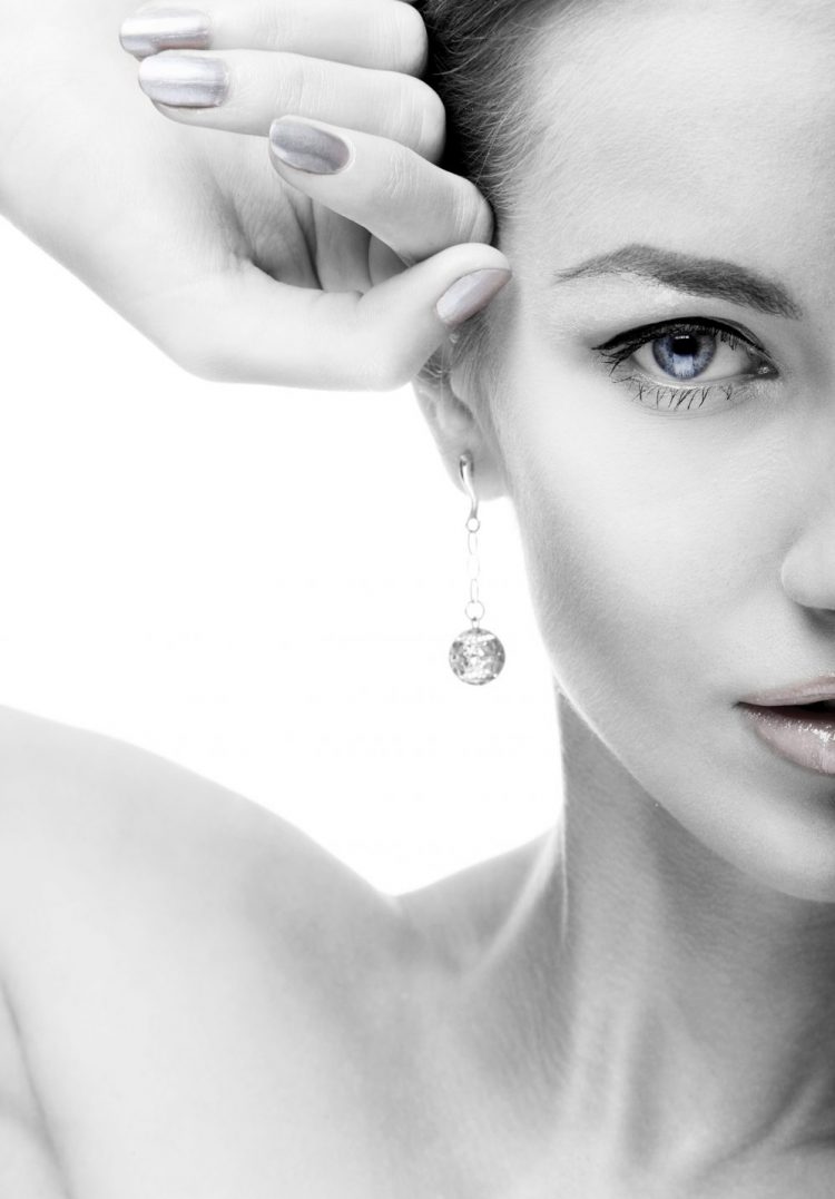 close-up portrait of beautiful blue eyed caucasian model on white